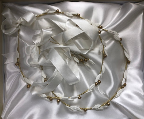 White and gold stefana for Orthodox wedding, made in Greece. White porcelain clay leaves with gold olives. Beautiful white satin ribbon attaches crowns together. 